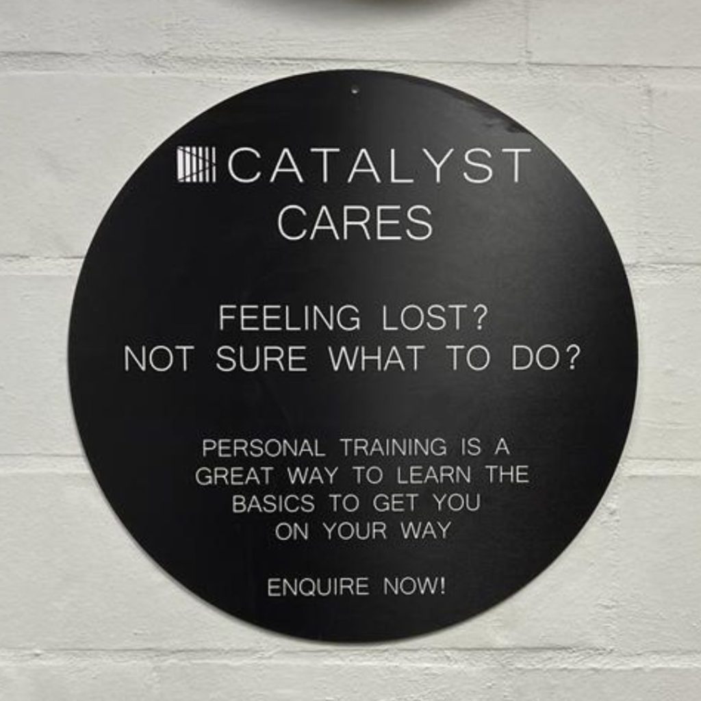 Catalyst 24/7 Fitness catalyst cares sign on wall
