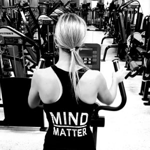Gym member in a 'Mind over Matter' singlet